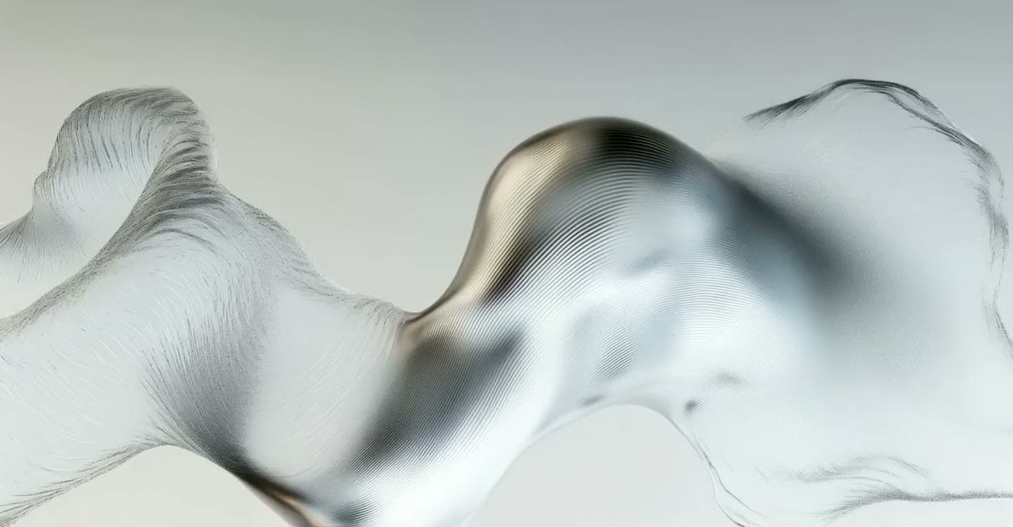 A slow wave of liquid silver fabric — an abstraction of the invisible structure of the universe